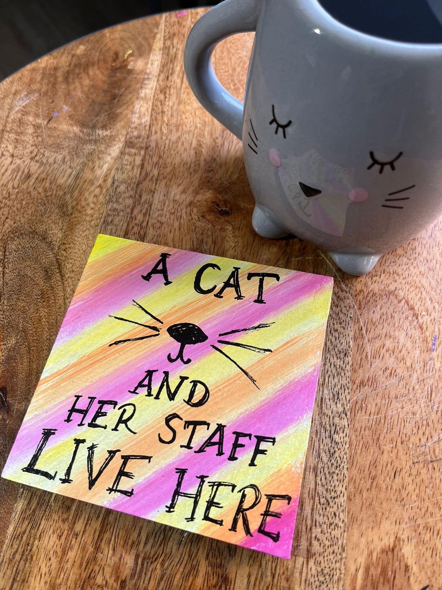 coaster: a cat/dog and her/his staff live her