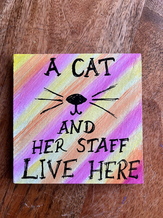 coaster: a cat/dog and her/his staff live her